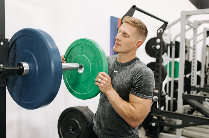 Brent Fikowski Holding Green Torque Bumper Plate