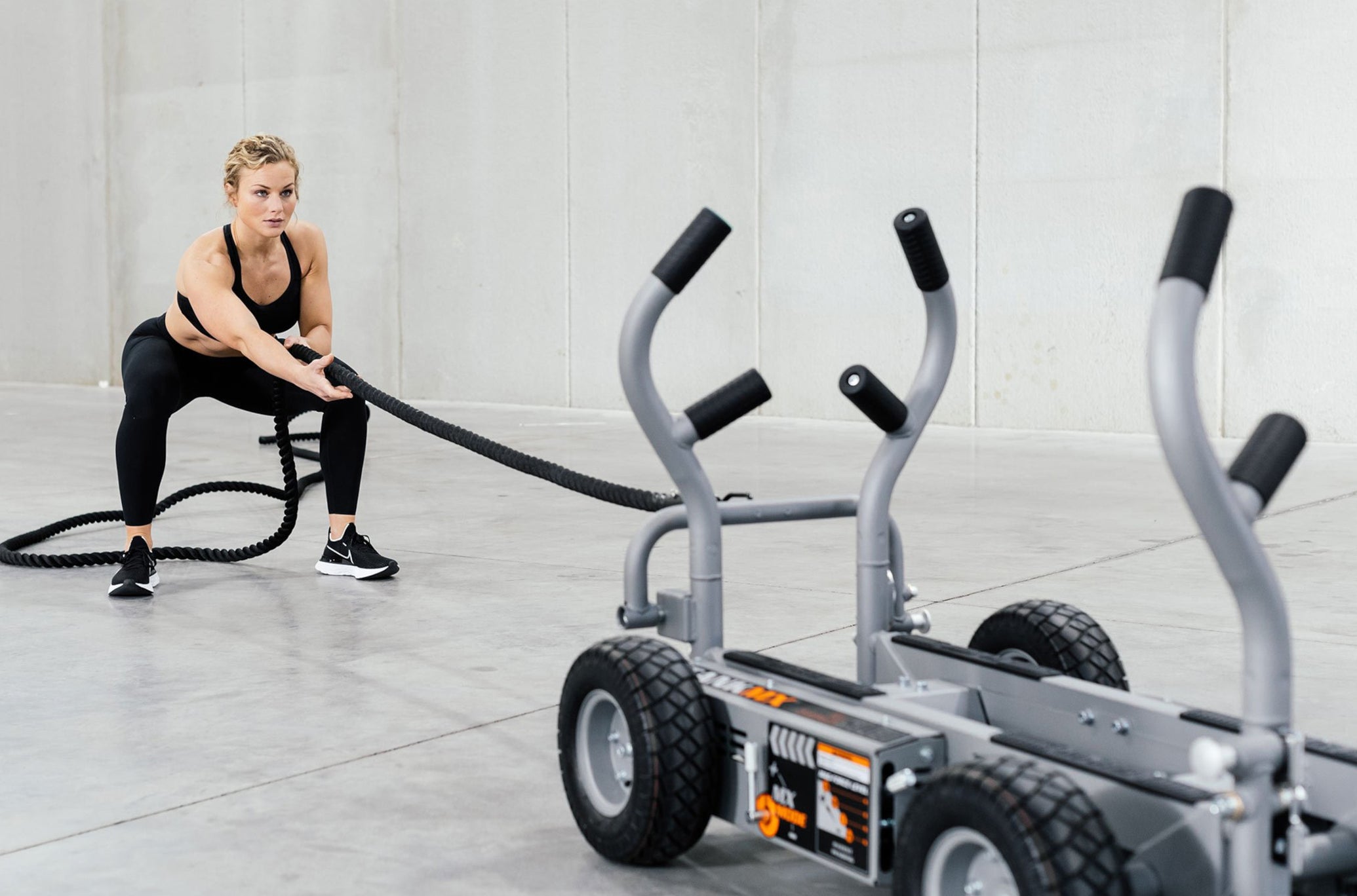 Woman Pulling TANK MX With TANK Tow Rope Accessory<black>